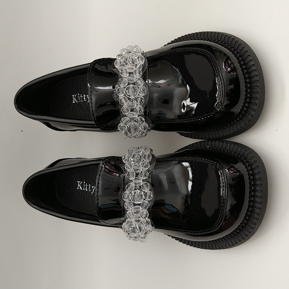 Brand New, Never Worn black patent leather Mary Janeshoes with clear beaded band